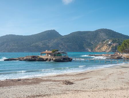 Beautiful sand beach at bay in Camp de Mar, Majorca Spain, Balearic islands. Bar on the islandの写真素材