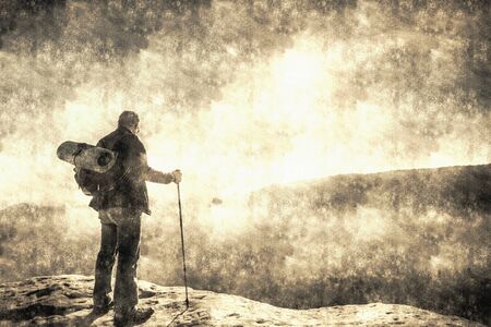 Hiker camping person prepares to travel the world. How to explore the misty world. Calotype filter. Old photo style.の写真素材