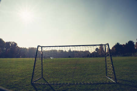 Abadoned village football stadium currently inactive. Captured in spring sunset, clear skyの写真素材