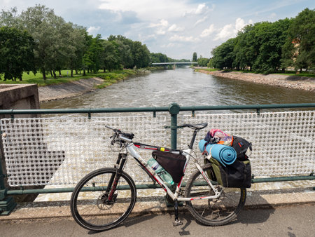 July 20th 2020, Podebrady, Czechia. Heavy loaded mtb on the bridge over Elbe river in Podebradyのeditorial素材