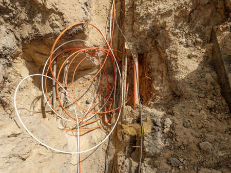 Building of lines of metallic, fiber optic cables in residential area. Fitting, ground.