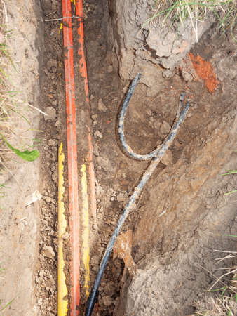 Building of cables communication optical network connection. Laying underground tow cable.の素材 [FY310152795286]