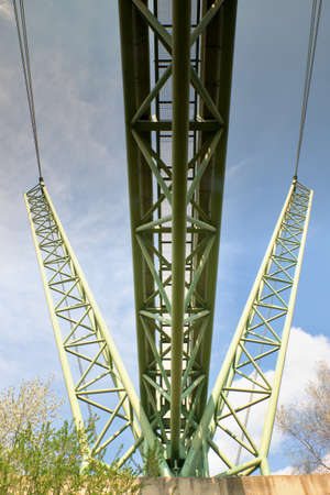 Hot steam for heating delivery. Suspension pipe bridge on Vltava river, Czech Republic. Modular steel girder framework detail, with metal grid, ribs and beams.の写真素材