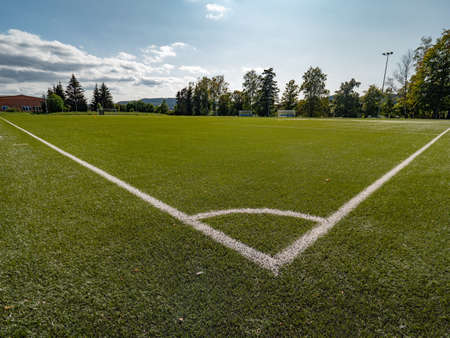 Football or Soccer green grass field, detail of the cornerの写真素材