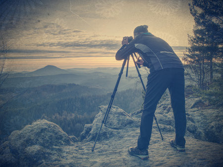 The photographer shoots the landscape. Abstract filter.の写真素材