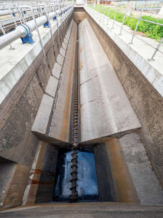 Cleaning grease trap sewage tank and shaft at town wastewater and sludge factoryの写真素材