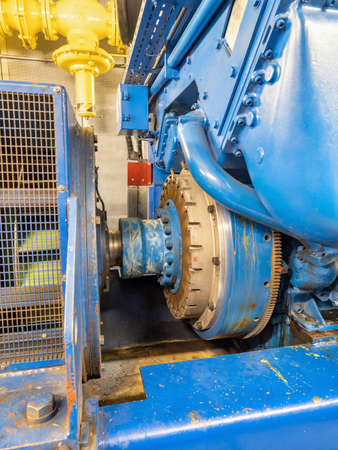 Starter gear. Detail of the shaft of an engine burning natural or bio gas and rotating with an...