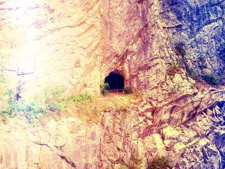Tunnel entrance. Mine cave tunnel entrance hole in the rock. Abstract.の写真素材