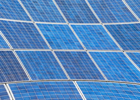 Electric Solar panels with a blue sky reflection. Concept of green energy alone, eco sustainable...