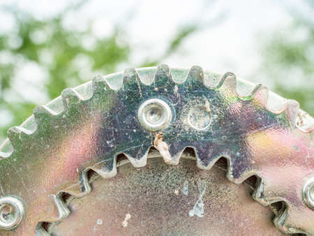 Boat trailer winch close-up, small metal mechanical teeth, yellow rope winch with a polished...