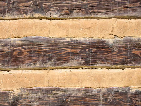 Cladding detail of the wall of an old half-timbered cottage. The original method of construction and maintenance of the timber structure.の写真素材