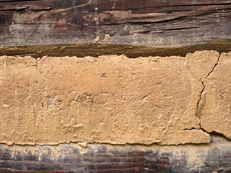 Timbered wooden wall in detail. Historical civil house made of wood logs