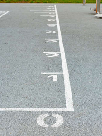 Number zero painted on soft rubber surface and other numbers. Jumping hopscotch game with numbers....
