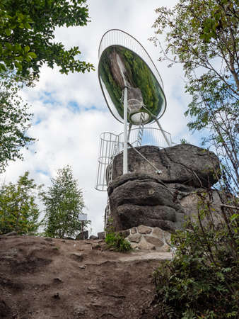 High view tower in design of comic speech bubble in the forest, low angle shot. Interesting lookout tower Spicka, a viewing platform in the design of a spaceshipの写真素材