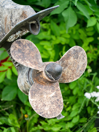 Closeup fishing boat screw propeller. Worn out and rusty aluminumの写真素材