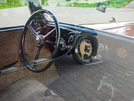 Palavsky Oldtimer, the vintage rally show at Winery Zajeci, Czechia. 27th of August, 2021. Steering wheel of Peugeot 201 vintage car. Historical cars open competition.のeditorial素材