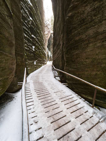 Scenic detail of path in Sandstone rocky labyrinth in Adrspach during winter season, Czech republicの写真素材
