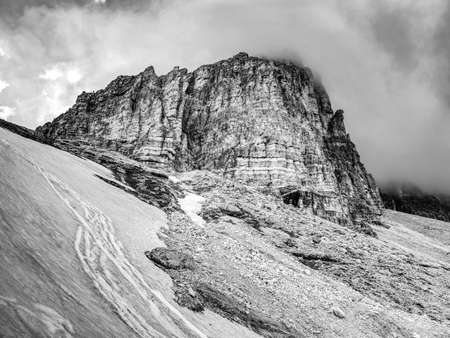 Tre Cime di Lavaredo rocks hidden in gentle fog. Early summer trip in Dolomites in Italy. BW, Black and white,の写真素材