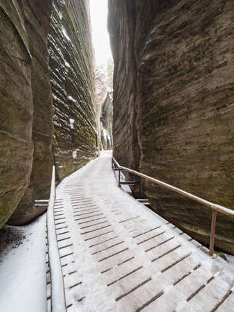Rocky labyrinth of Adrspach rocky park. Christmas time visit. Hiking between sandstone rocks and pillars.の写真素材