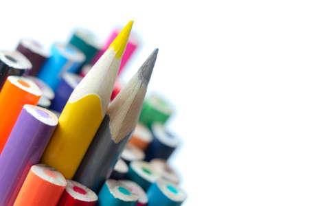 A few colored inverted pencils on white blank paper. Two yellow and gray pencils symbolize the trend colors of 2021. Creative compositionの写真素材