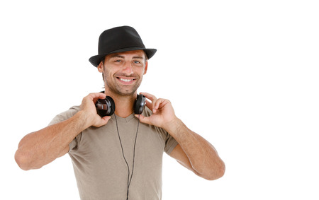 Young man listening to music isolated on white background