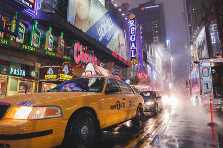 MANHATTAN, NY - February 20, 2011: Yellow Taxi on Broadway at Times Square in Manhattan, New York...
