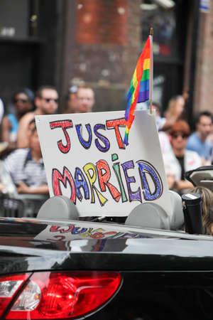 MANHATTAN, NY - June 26, 2011: Colorful balloons and rainbow flags at the 2011 Gay Pride Parade on Fifth Avenue, New York City.のeditorial素材