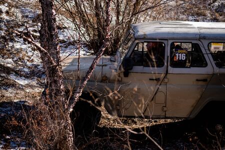 Jeep UAZ overcomes obstacles in the forest