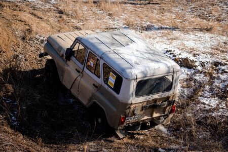 Khabarovsk, Russia - Nov 11, 2019: Jeep UAZ overcomes obstacles in the forest.のeditorial素材