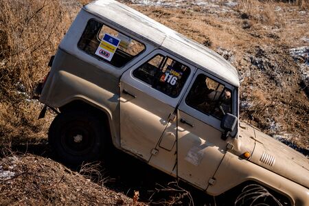Jeep UAZ overcomes obstacles in the forestのeditorial素材