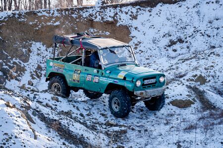 Jeep Suzuki Jimny overcomes obstacles in the forestのeditorial素材