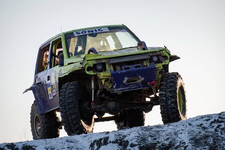 Jeep Suzuki Jimny overcomes obstacles in the forestのeditorial素材
