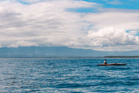 Tourists watch wild dolphins in the sea at Manjuyod White Sand barのeditorial素材