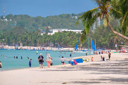 White beach of Boracay island. Tourists walk along the beach and swim in the sea. A few days before the outbreak of the coronavirusのeditorial素材