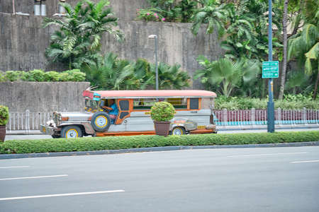 Manila, Philippines - Feb 02, 2020: Jeepneys on the roads of Manila. Former American military jeeps converted to public transportのeditorial素材