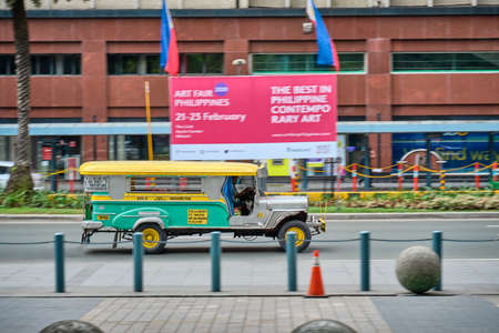 Manila, Philippines - Feb 02, 2020: Jeepneys on the roads of Manila. Former American military jeeps converted to public transportのeditorial素材
