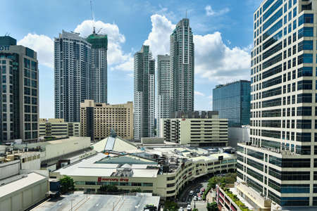 View of Makati city during the day. Skyscrapers in clear Sunny weather.