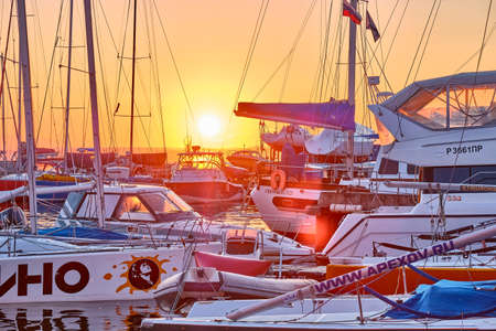 Vladivostok, Russia -Jul 01, 2020: sunset at the boat station. Yachts and boats on the background of the sea and the setting sunのeditorial素材