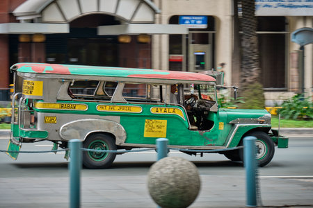 Manila, Philippines - Feb 02, 2020: Jeepneys on the roads of Manila. Former American military jeeps converted to public transportのeditorial素材