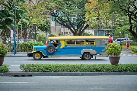 Manila, Philippines - Feb 02, 2020: Jeepneys on the roads of Manila. Former American military jeeps converted to public transportのeditorial素材