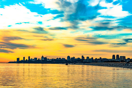 The sun went over the horizon of the Amur river in the city of Khabarovsk, forming magnificent colors in the sky. Beautiful colors in the sky, which are reflected in the water.の写真素材