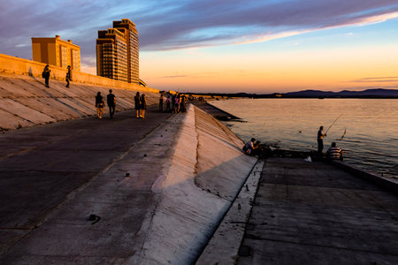 The sun went over the horizon of the Amur river in the city of Khabarovsk, forming magnificent colors in the sky. Beautiful colors in the sky, which are reflected in the water.の写真素材