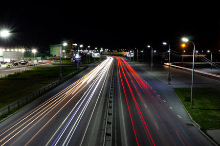 Smeared lights from cars on the night street. Bright colors.