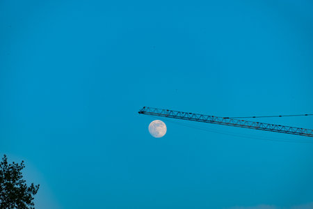Full moon isolated on a black skyの写真素材