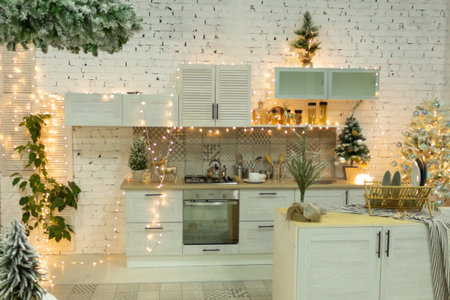Beautiful kitchen in white decorated to celebrate Christmas and New year. Set the table.の写真素材