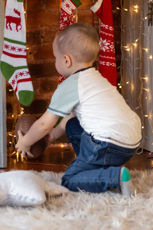 Little boy takes Christmas giftsの写真素材