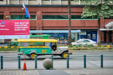 Manila, Philippines - Feb 02, 2020: Jeepneys on the roads of Manila. Former American military jeeps converted to public transportのeditorial素材