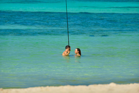 Boracay, Philippines - Jan 29, 2020: White beach of Boracay island. Tourists walk along the beach and swim in the sea. A few days before the outbreak of the coronavirusのeditorial素材