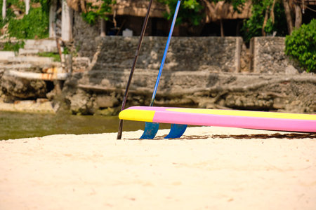 Empty White beach of Boracay island in the daytime. No Chinese tourists because of the coronavirus. A traditional Filipino boat stands on a white beachの写真素材
