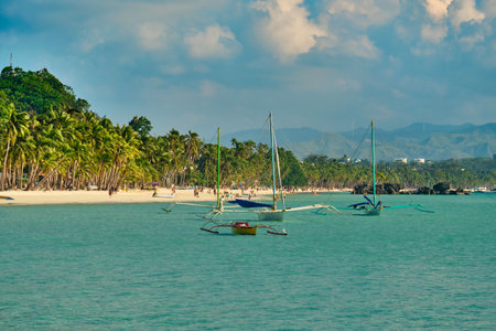 White beach of Boracay island. Tourists walk along the beach and swim in the sea. A few days before the outbreak of the coronavirusの写真素材